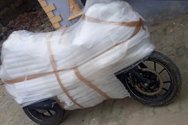 Two-wheeler bike packed with foam and stretch wrap